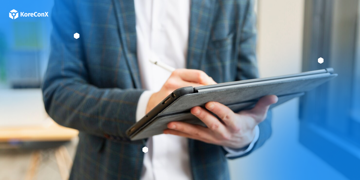 Image of a person holding a tablet, researching what is an escrow provider.
